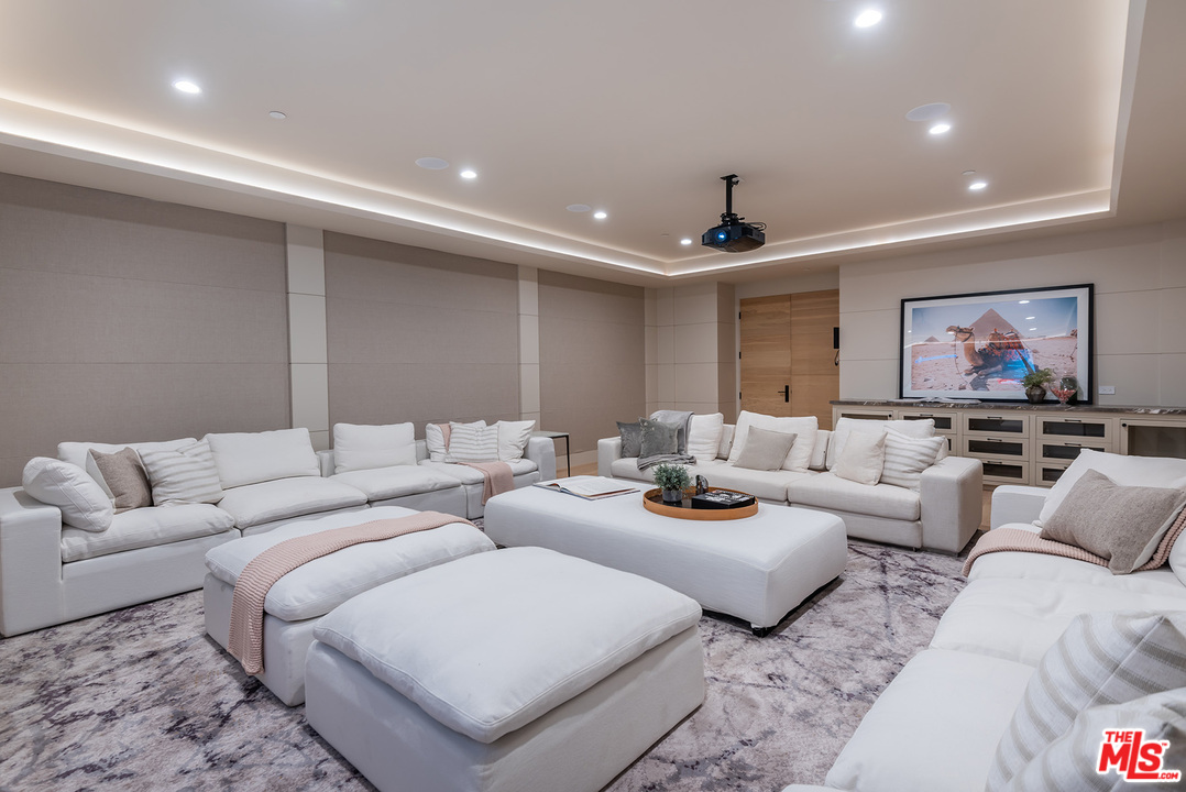 5716 Jed Smith Road Hidden Hills, CA 91302 - Photo 23 of 53 a living room with furniture and a ceiling fan
