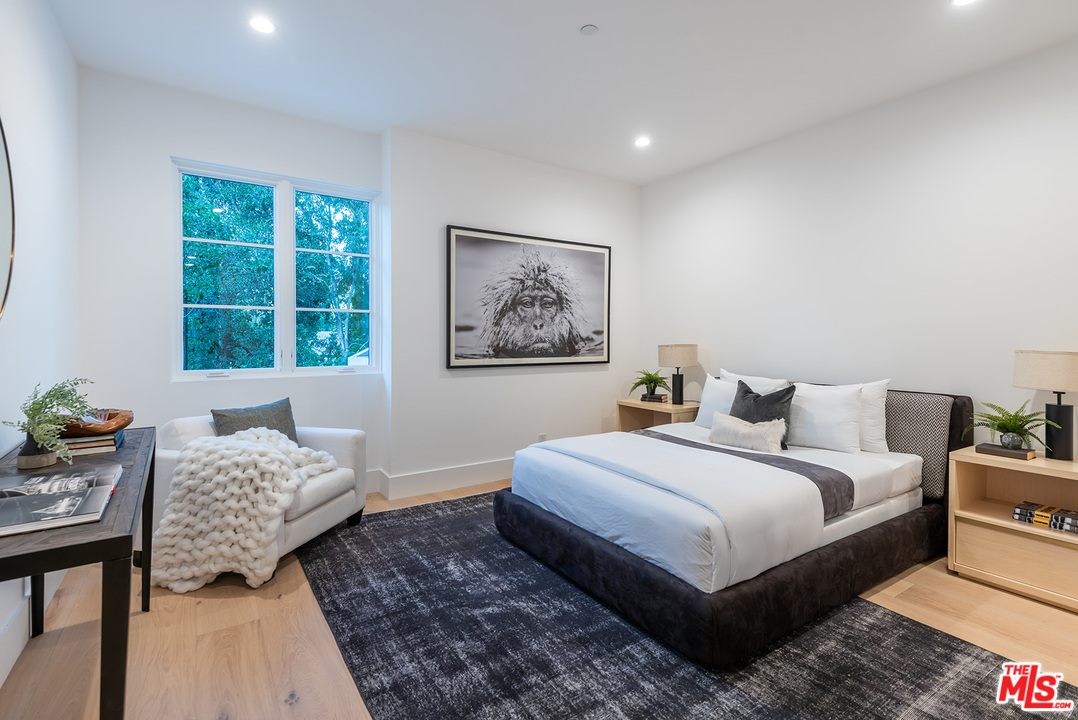 5716 Jed Smith Road Hidden Hills, CA 91302 - Photo 28 of 53 a bedroom with bed and a window