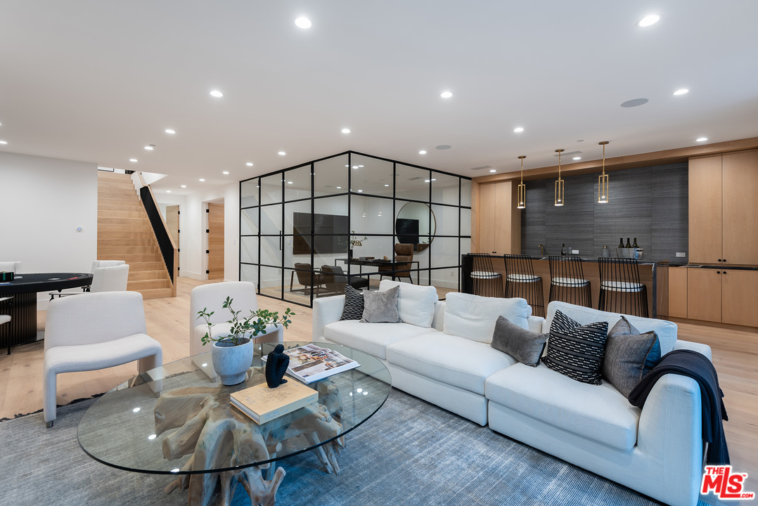 5716 Jed Smith Road Hidden Hills, CA 91302 - Photo 30 of 53 a living room with furniture kitchen and a table