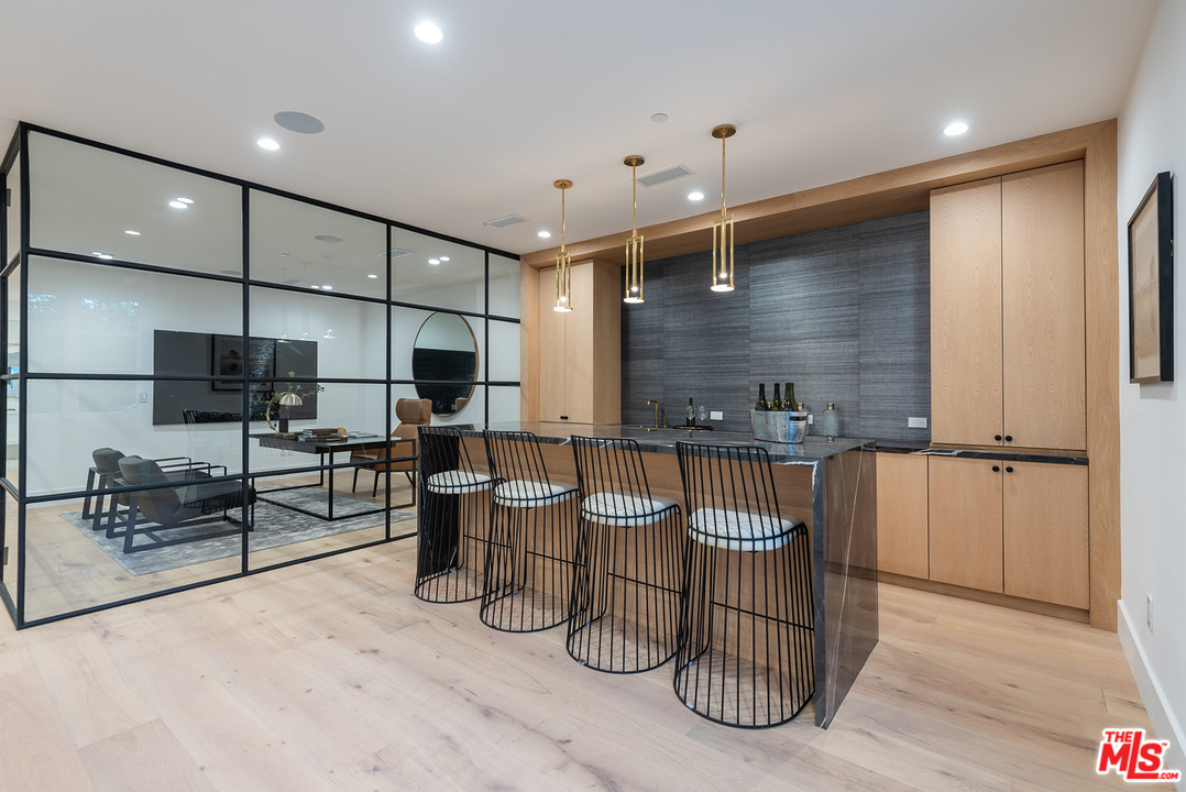 5716 Jed Smith Road Hidden Hills, CA 91302 - Photo 31 of 53 a room with lots of chairs and mirrors