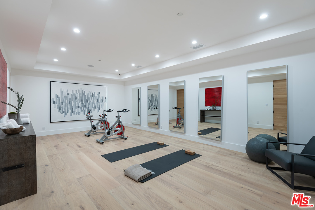 5716 Jed Smith Road Hidden Hills, CA 91302 - Photo 33 of 53 a living room with furniture and a flat screen tv