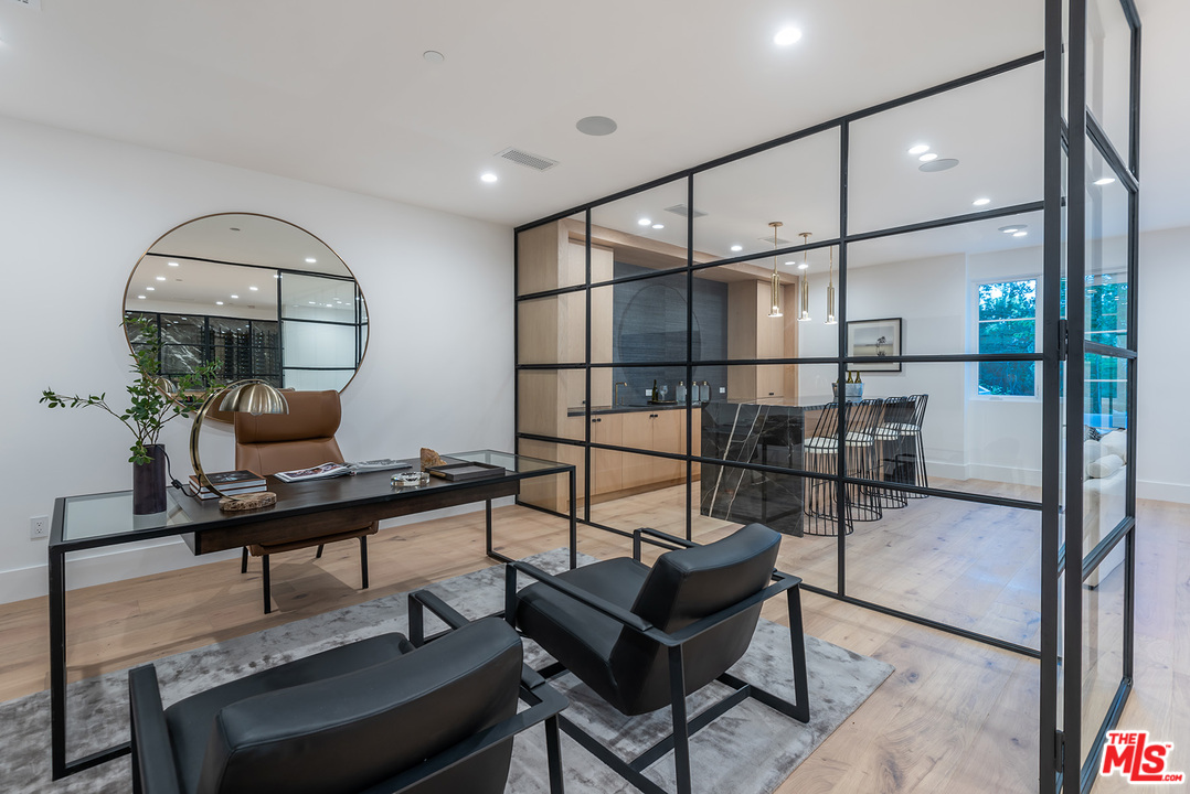 5716 Jed Smith Road Hidden Hills, CA 91302 - Photo 34 of 53 a room with lots of furniture and a painting on the wall