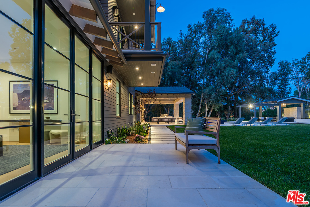 5716 Jed Smith Road Hidden Hills, CA 91302 - Photo 5 of 53 a view of a house with a patio