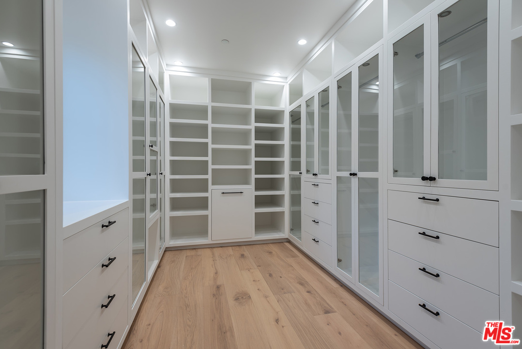 5716 Jed Smith Road Hidden Hills, CA 91302 - Photo 42 of 53 a view of walk in closet with empty racks