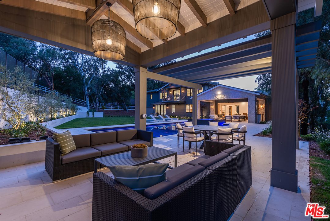 5716 Jed Smith Road Hidden Hills, CA 91302 - Photo 48 of 53 a outdoor living space with furniture and a fireplace