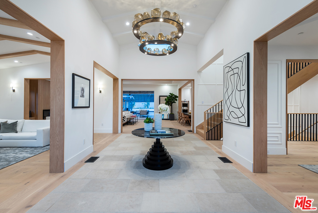 5716 Jed Smith Road Hidden Hills, CA 91302 - Photo 6 of 53 a view of a hallway to a livingroom with furniture