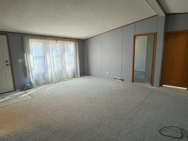 a view of an empty room and window