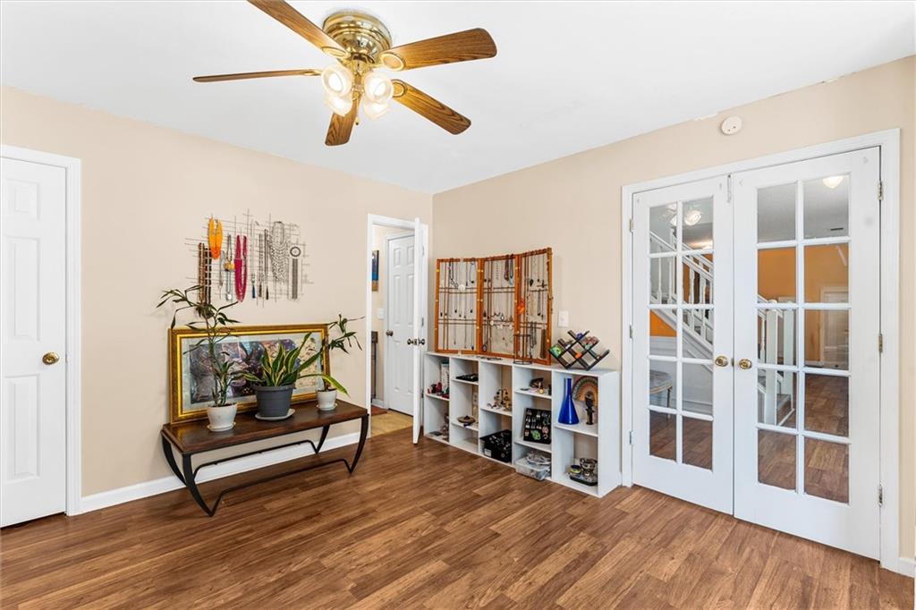 3234 Mineral Ridge Lane Stone Mountain, GA 30087 - Photo 22 of 55 a living room with furniture and a floor to ceiling window