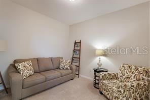8653 Karpeal Drive, Unit 4 Sarasota, FL 34238 - Photo 11 of 14 a living room with a couch