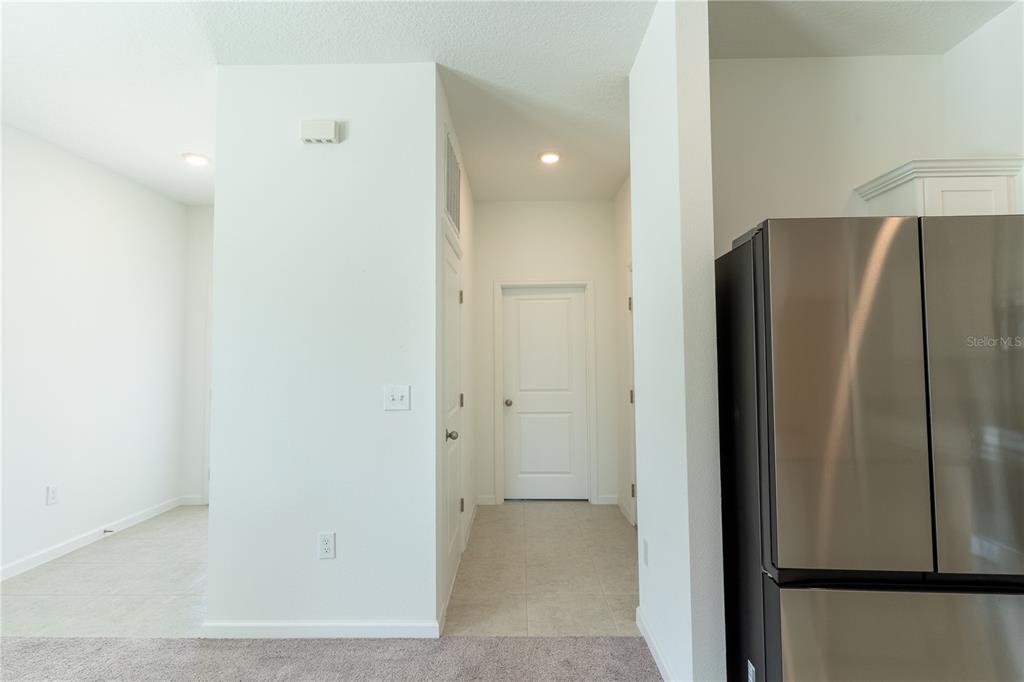 2248 Crossbow Street Minneola, FL 34715 - Photo 17 of 33 a view of a refrigerator in kitchen and a refrigerator