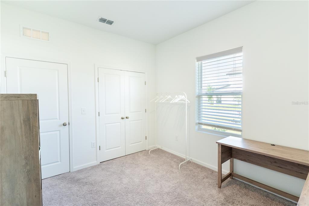 2248 Crossbow Street Minneola, FL 34715 - Photo 20 of 33 a view of room with window and a ceiling fan