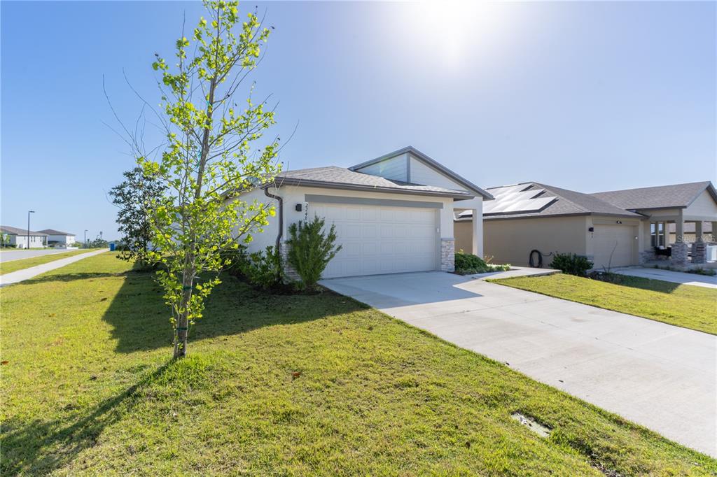 2248 Crossbow Street Minneola, FL 34715 - Photo 3 of 33 a house with swimming pool in front of it
