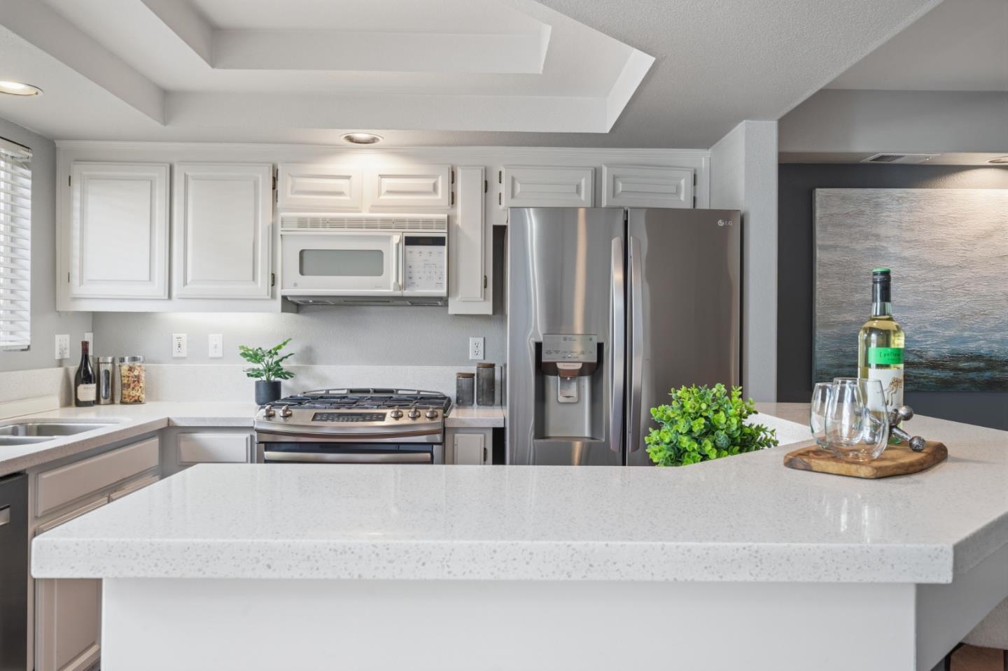 71 Patrick Way Half Moon Bay, CA 94019 - Photo 12 of 37 a kitchen with kitchen island a counter top space cabinets and stainless steel appliances