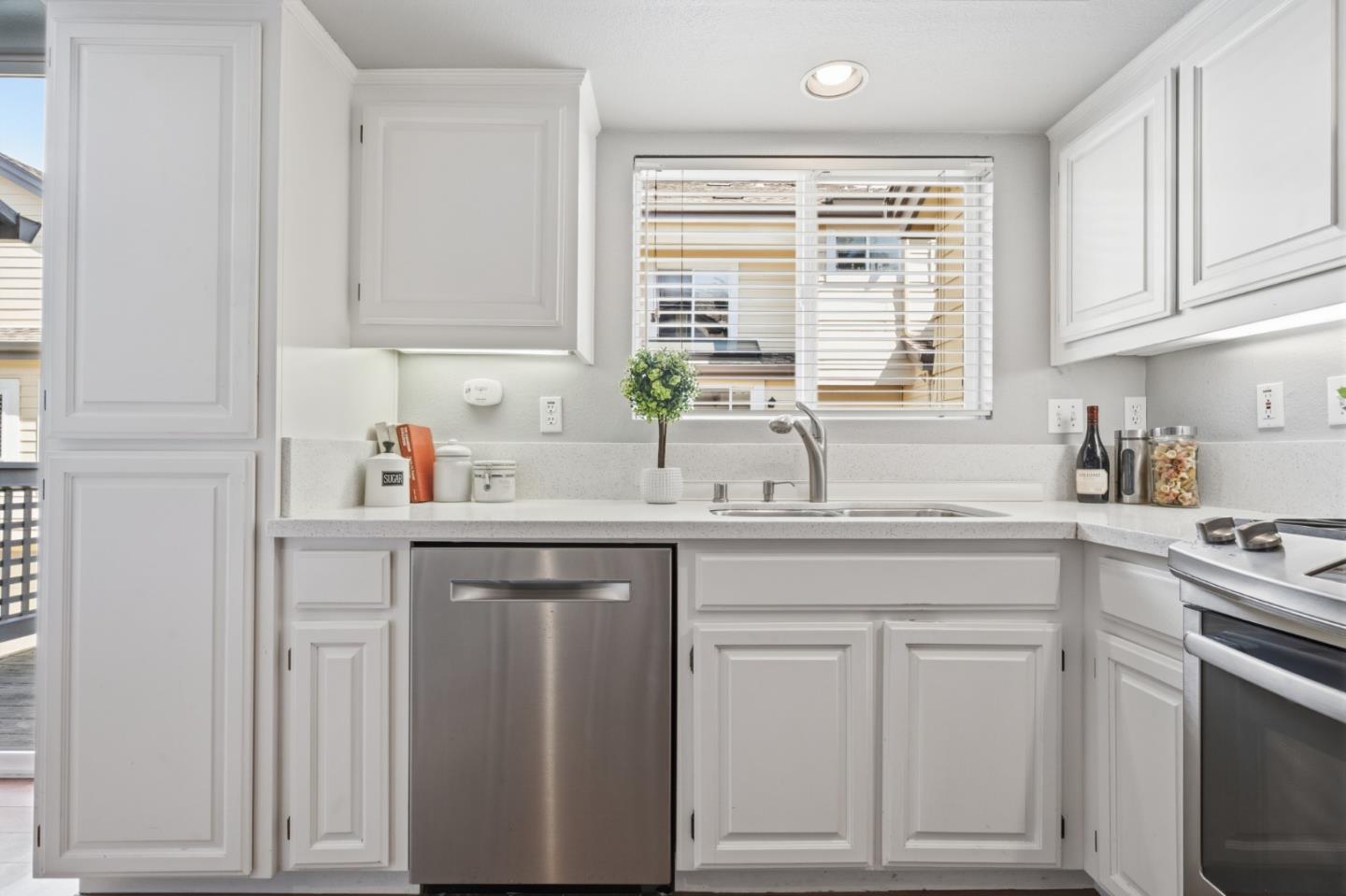 71 Patrick Way Half Moon Bay, CA 94019 - Photo 14 of 37 a kitchen with white cabinets and a window