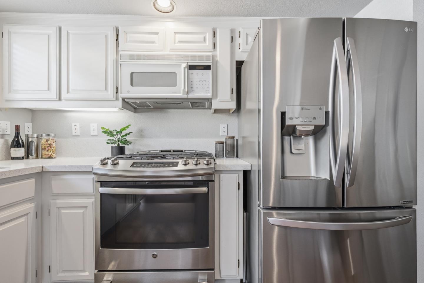 71 Patrick Way Half Moon Bay, CA 94019 - Photo 15 of 37 a kitchen with stainless steel appliances white cabinets and a stove