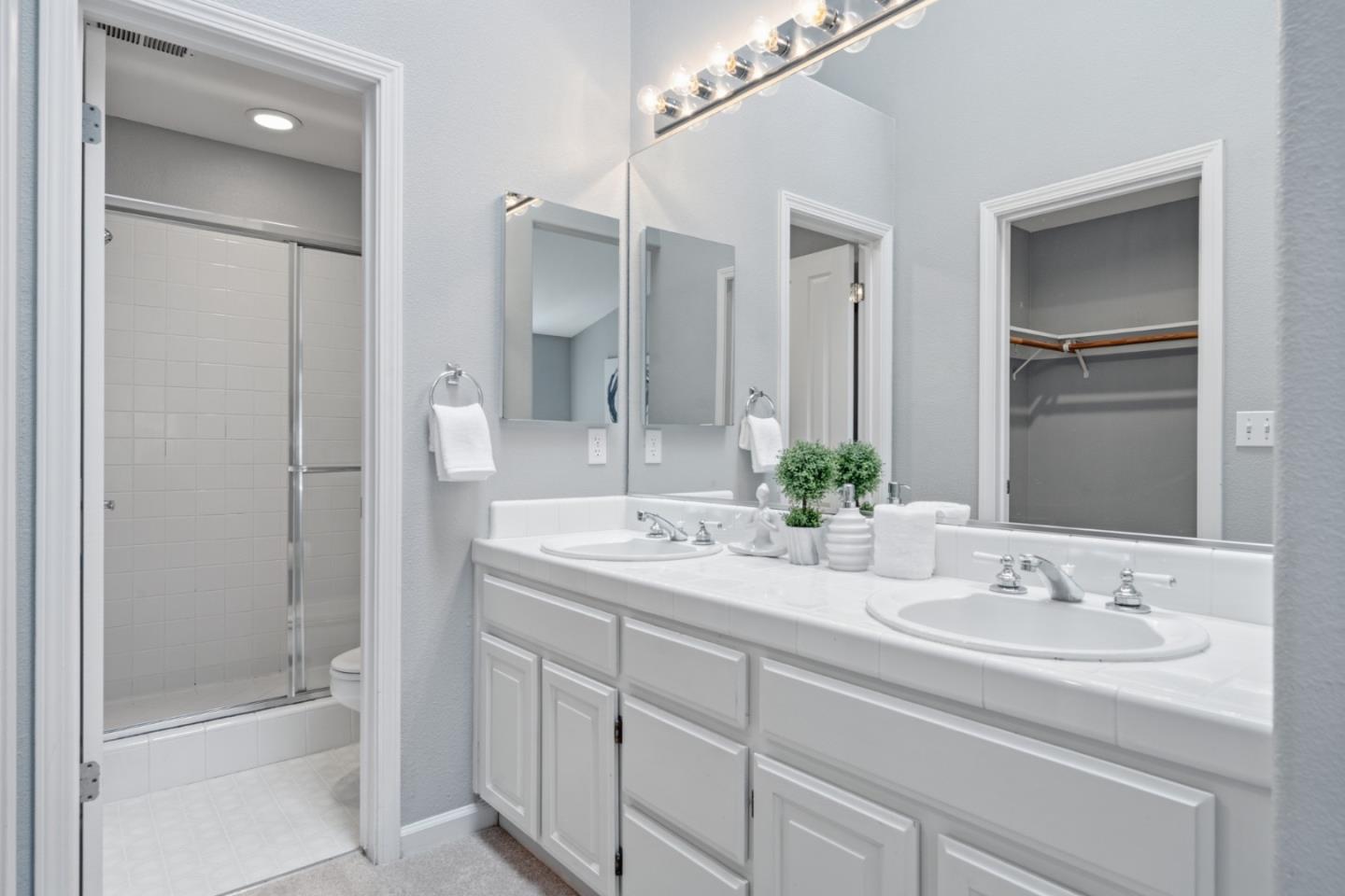 71 Patrick Way Half Moon Bay, CA 94019 - Photo 22 of 37 a bathroom with a granite countertop sink mirror and a