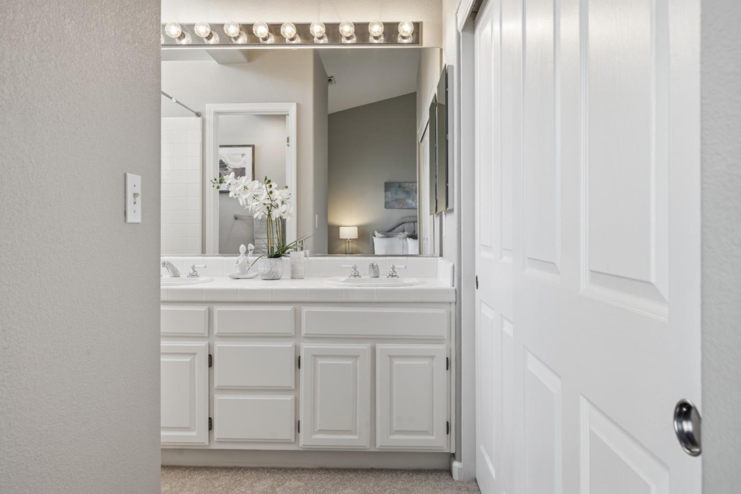 71 Patrick Way Half Moon Bay, CA 94019 - Photo 27 of 37 a bathroom with a sink vanity and a mirror