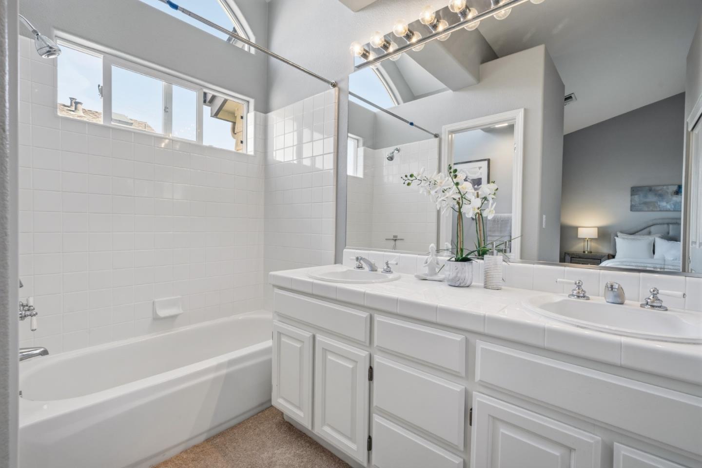 71 Patrick Way Half Moon Bay, CA 94019 - Photo 28 of 37 a bathroom with a tub sink and mirror
