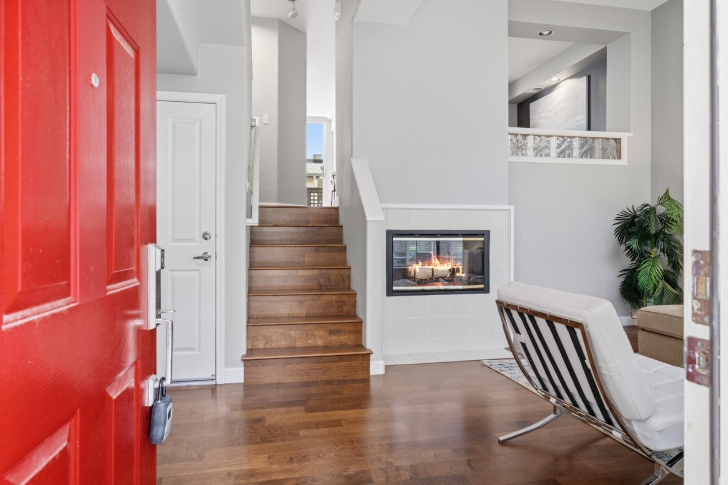 71 Patrick Way Half Moon Bay, CA 94019 - Photo 3 of 37 a view of a hallway with wooden floor and staircase