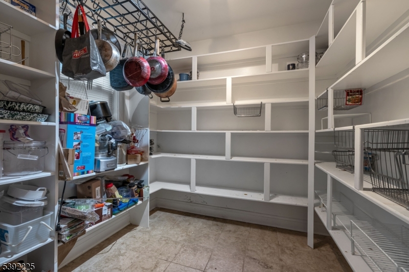 255 Knoll Road Lake Hiawatha, NJ 07034 - Photo 15 of 32 a kitchen area with lots of different colored cloths