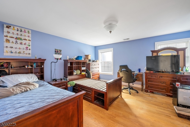 255 Knoll Road Lake Hiawatha, NJ 07034 - Photo 23 of 32 a bedroom with furniture and a flat screen tv