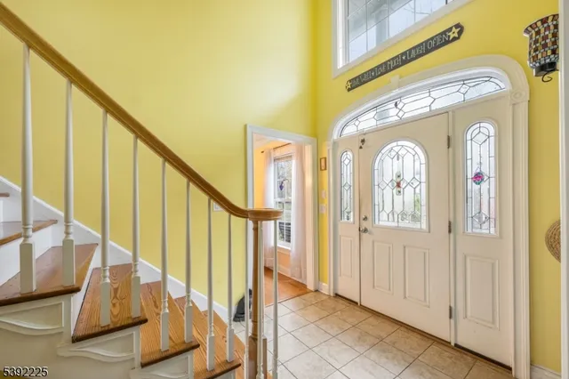 a view of an entryway with wooden floor and door