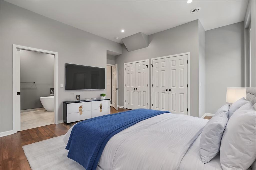 111 Hemlock Street Pittsburgh, PA 15212 - Photo 25 of 50 Just relax and say ahhhhhh. Your primary bedroom is serene. so much closet space! So much room to decorate and design! And look at those gorgeous windows! Plus, walk right into your ensuite bathroom!