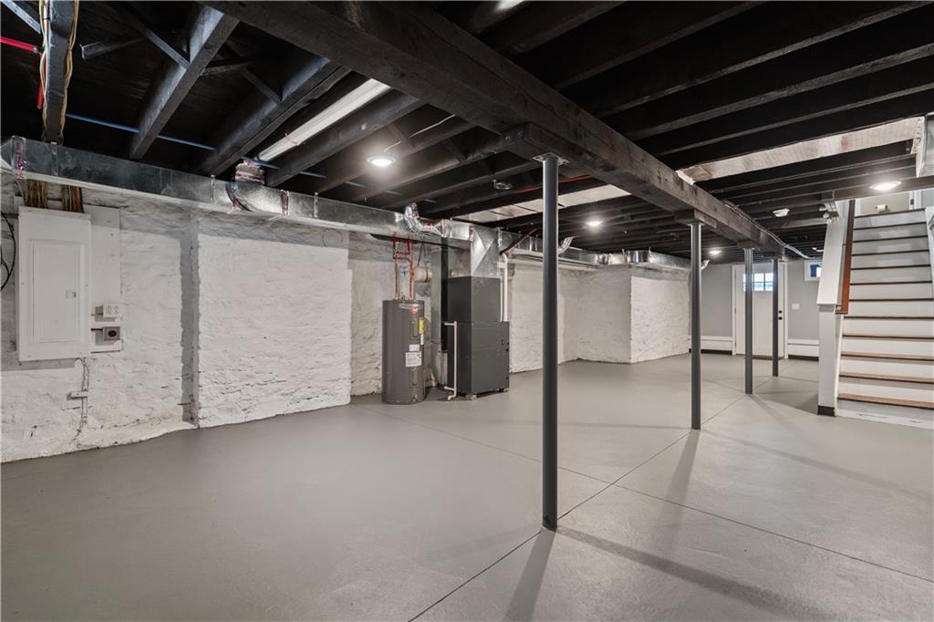 111 Hemlock Street Pittsburgh, PA 15212 - Photo 43 of 50 The lower level is pristine and easily ready to be finished. Everything is new. New lower level concrete floor. New sewer line. New plubing. New 200 AMP panel. Eletrical and gas is run for an additional laundry space. Step outside to your lower level concrete patio, fenced-in backyard and two car parking area!