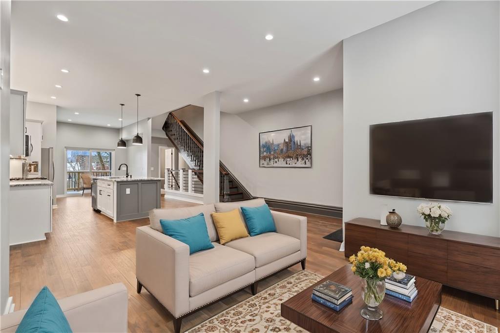 111 Hemlock Street Pittsburgh, PA 15212 - Photo 5 of 50 Here's just one idea of how to decorate your new space! Entertain friends and family in your open concept living that flows seamlessly onto your brand new deck. Do you have a grill yet? ;) Spring will be here before you know it!