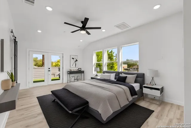 an empty room with closet and windows