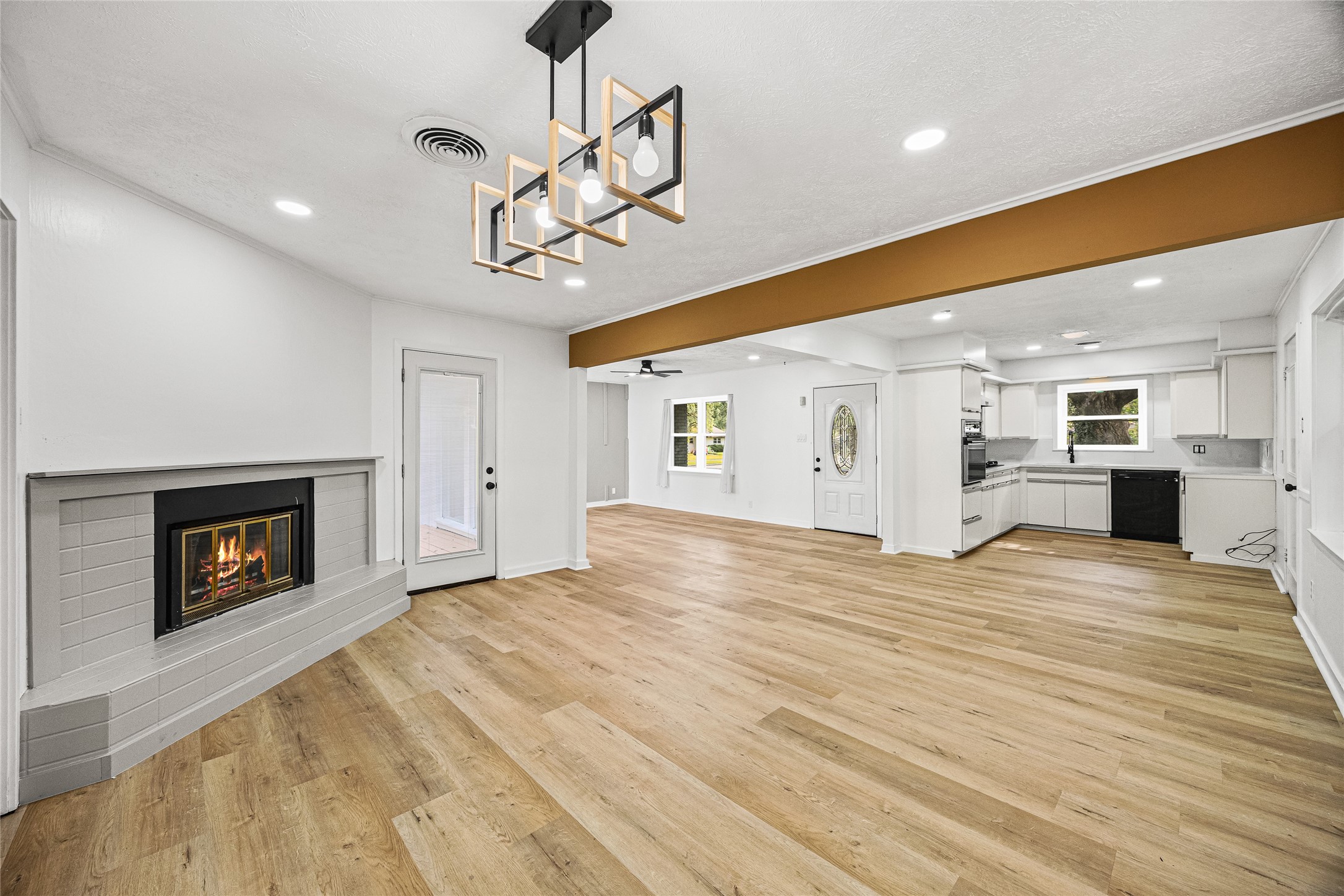 10259 Old Orchard Road La Porte, TX 77571 - Photo 11 of 23 a view of empty room with a fireplace and wooden floor