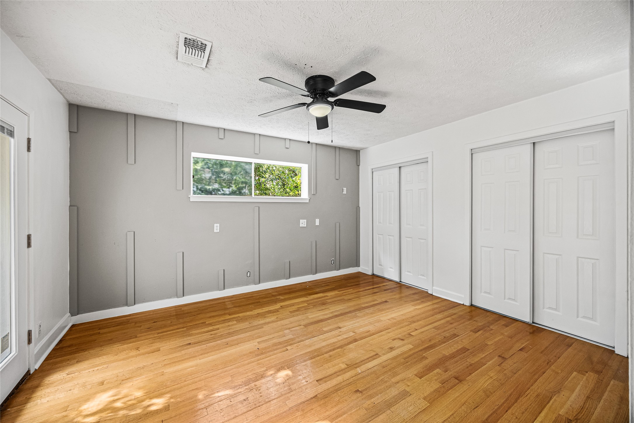 10259 Old Orchard Road La Porte, TX 77571 - Photo 14 of 23 a view of a room with a ceiling fan and a window