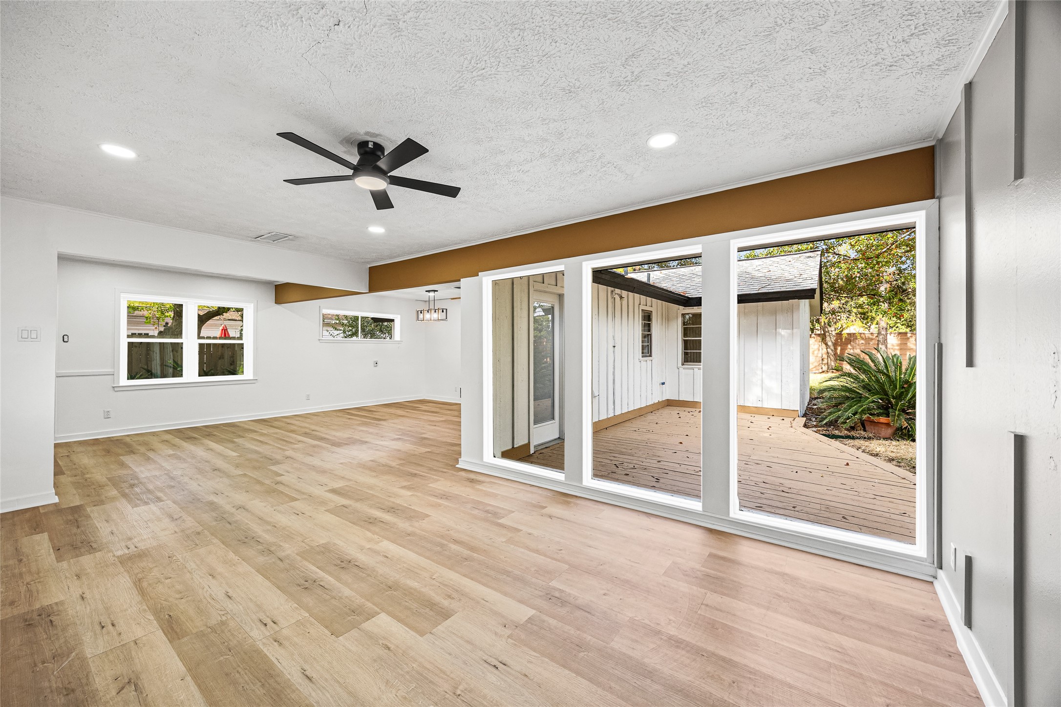 10259 Old Orchard Road La Porte, TX 77571 - Photo 3 of 23 a view of empty room with wooden floor and fan