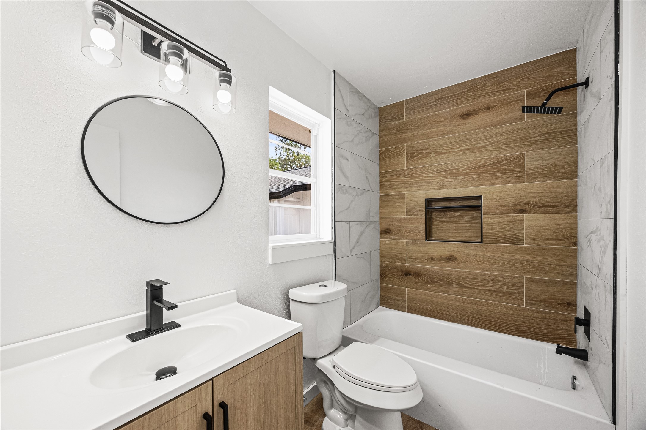 10259 Old Orchard Road La Porte, TX 77571 - Photo 8 of 23 a bathroom with a sink a toilet and a mirror