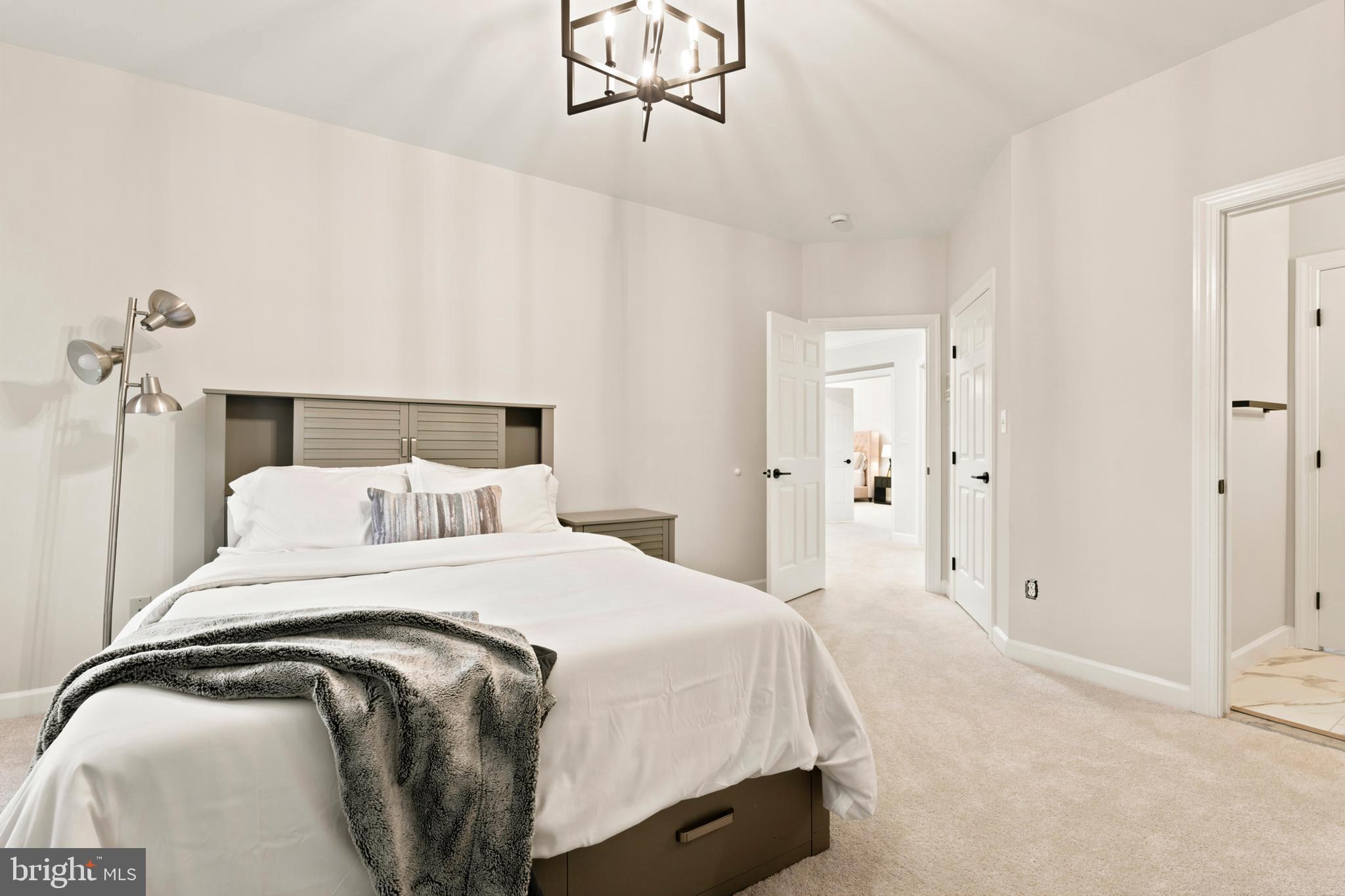 9313 Harrisons Farm Way Laytonsville, MD 20882 - Photo 46 of 77 a bedroom with a bed and painting on the wall