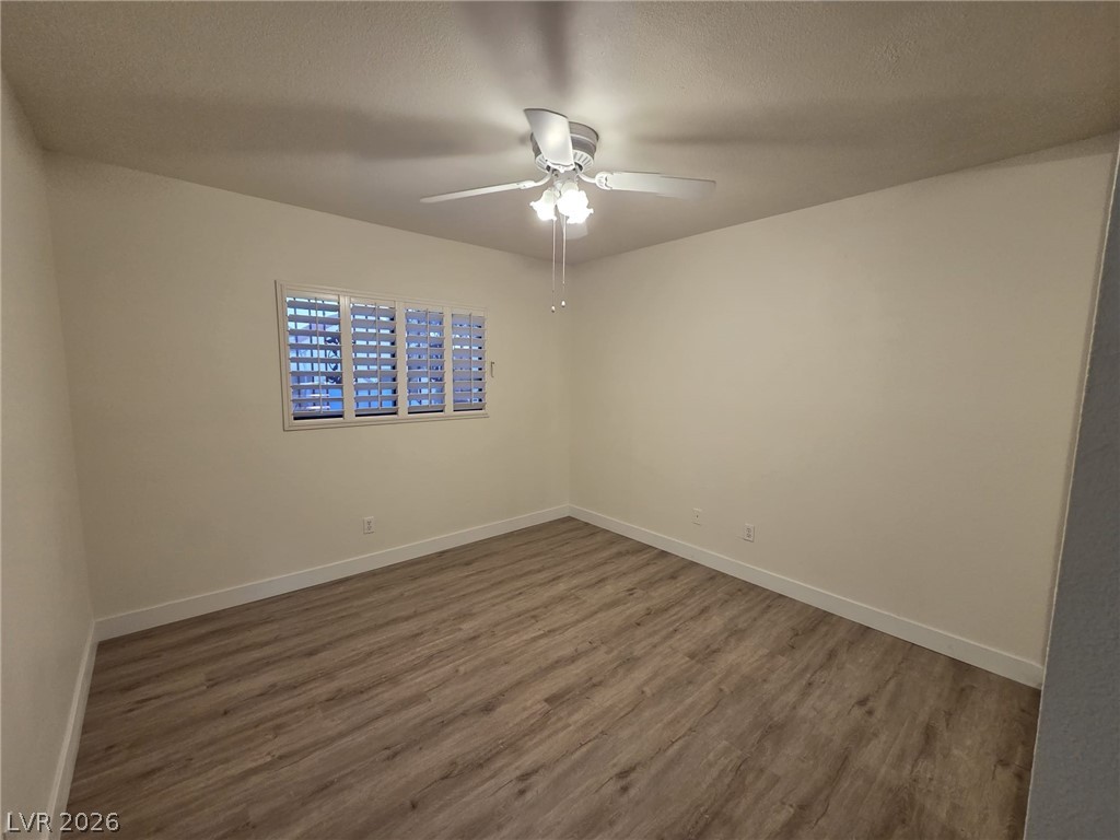 3317 Racquet Street Las Vegas, NV 89121 - Photo 14 of 23 This inviting room features resilient flooring, a window with natural light, and a ceiling fan for comfort.