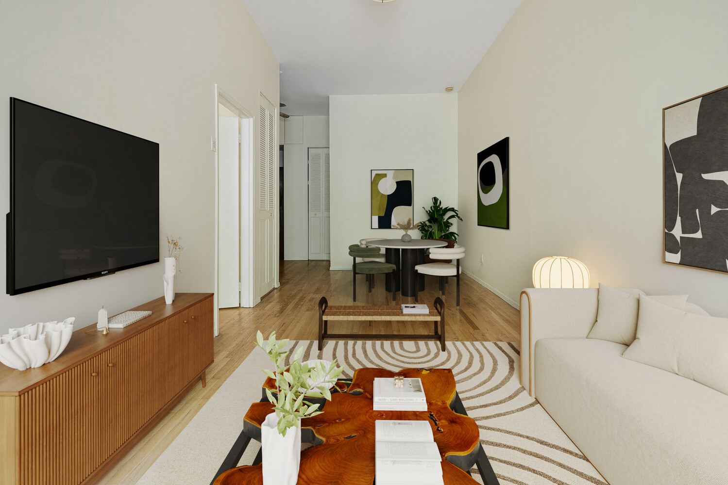 359 West 30th Street, Unit 2B Manhattan, NY 10001 - Photo 2 of 16 a living room with furniture and a flat screen tv