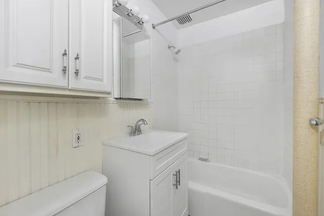 a bathroom with a sink a toilet and a bathtub