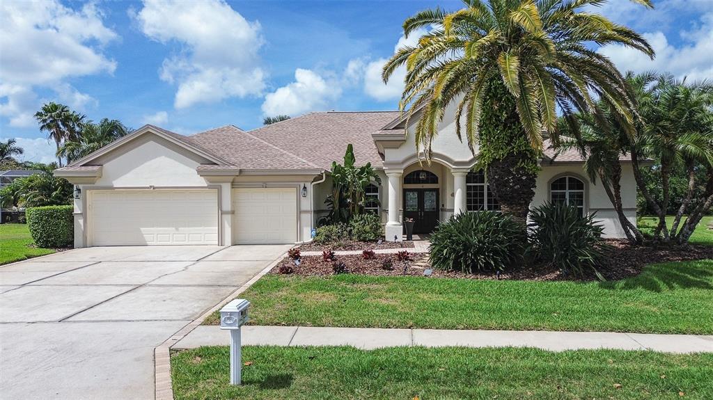 a front view of house with yard and green space