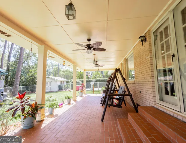 a view of a hall with wooden floor