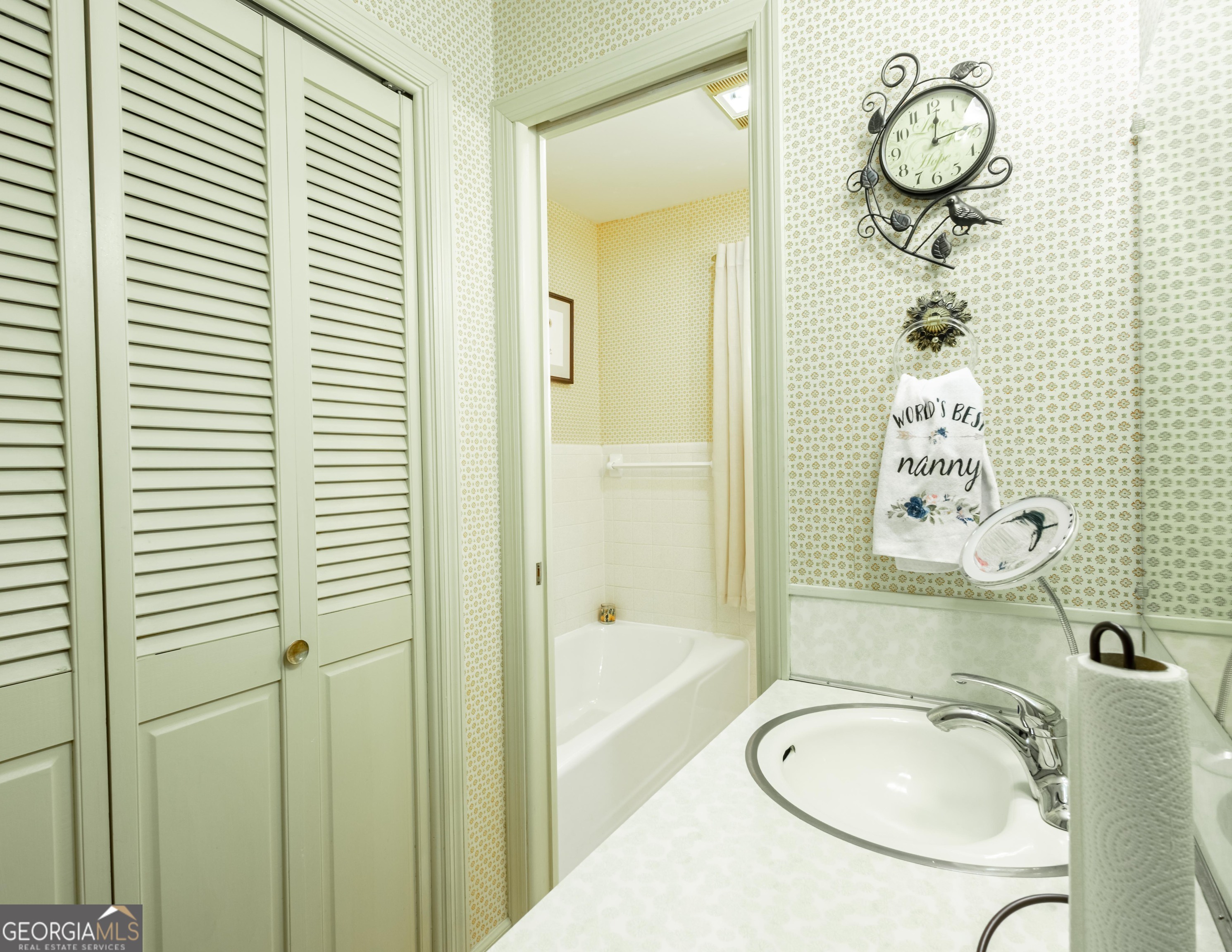 2021 Emory Drive Tifton, GA 31794 - Photo 23 of 43 a bathroom with a granite countertop sink a mirror and a shower
