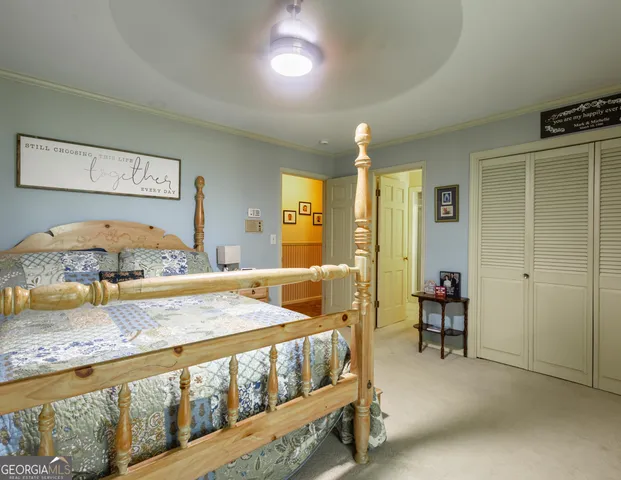 a bedroom with a bed and a table in it