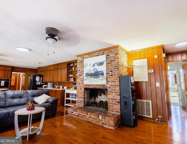 a view of a dining room with furniture wooden floor and chandelier