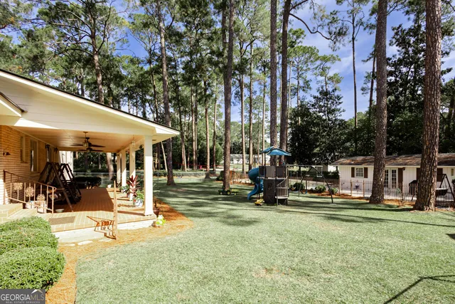 a view of a park with swings and slides