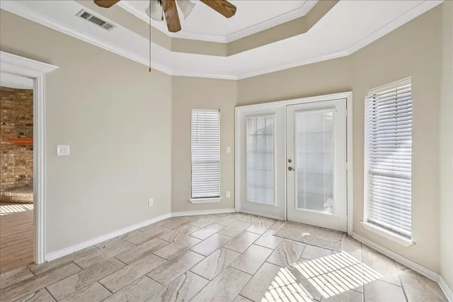 a view of a livingroom with wooden floor and cabinet