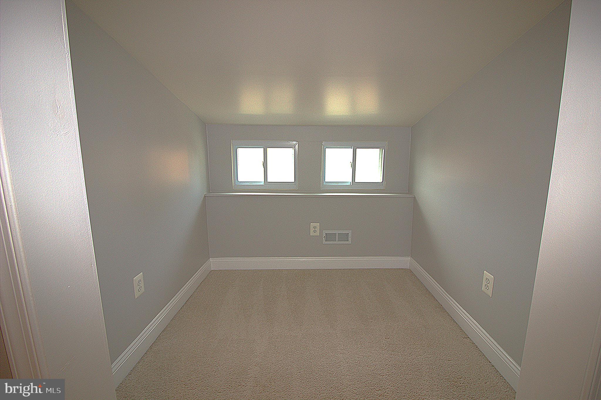 2919 Ritchie Avenue Baltimore, MD 21219 - Photo 22 of 24 an empty room that has a window