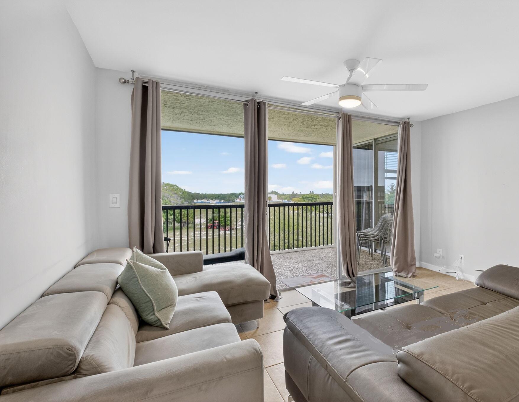 5280 Northwest 2nd Avenue, Unit PH17 Boca Raton, FL 33487 - Photo 7 of 35 7-Living Room and Balcony a