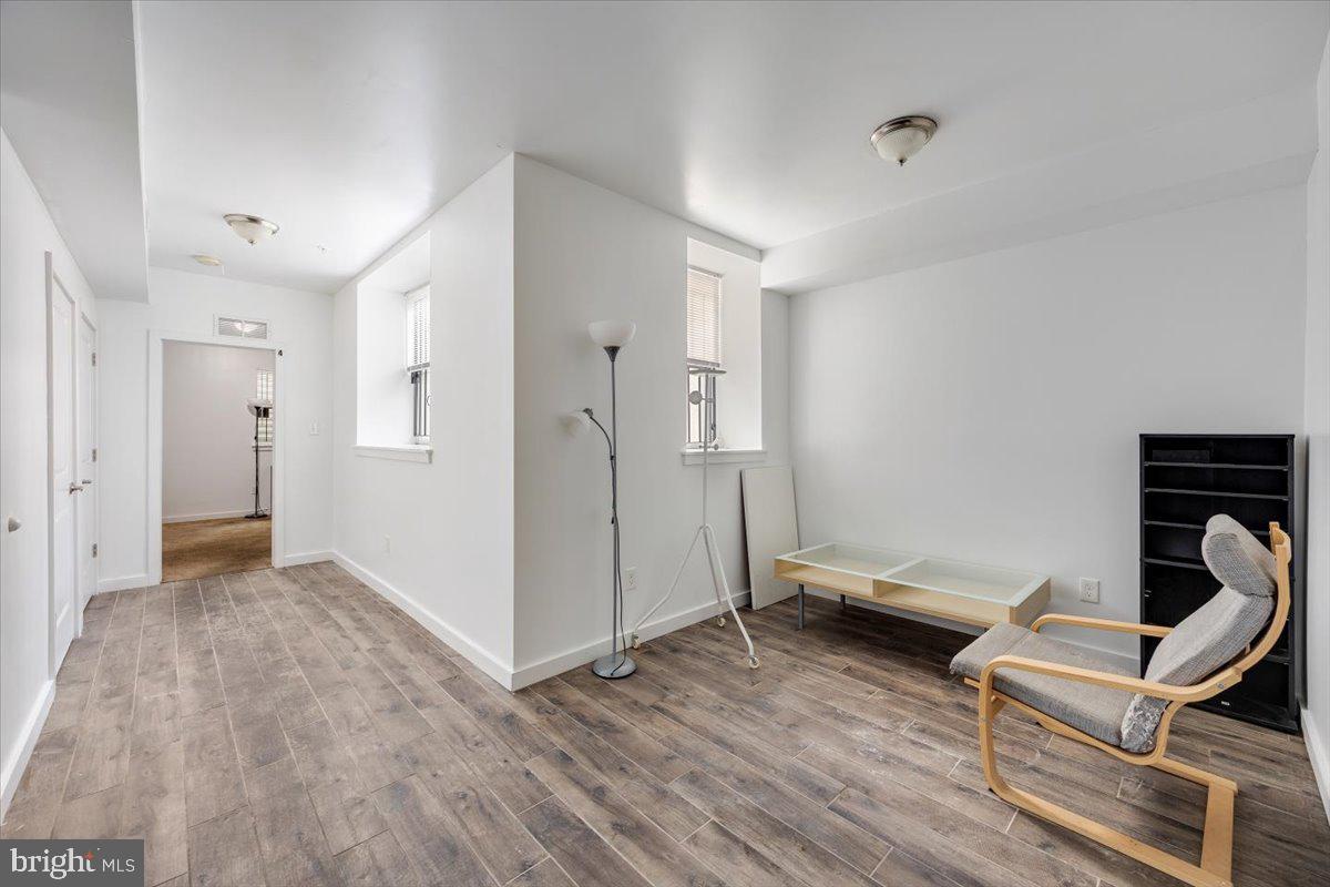 1322 North 15th Street, Unit A Philadelphia, PA 19121 - Photo 13 of 27 a living room with furniture and a wooden floor
