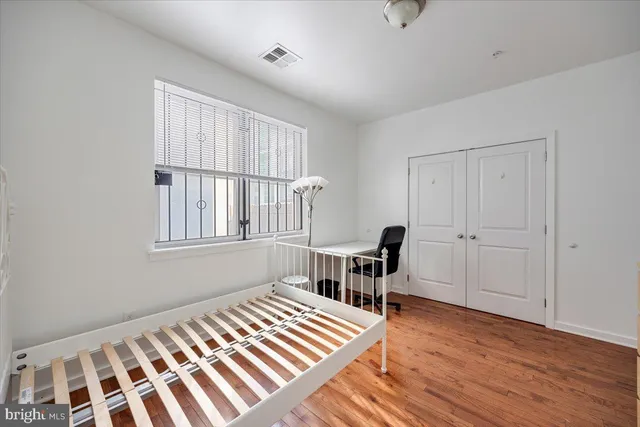 a bedroom with furniture and a window