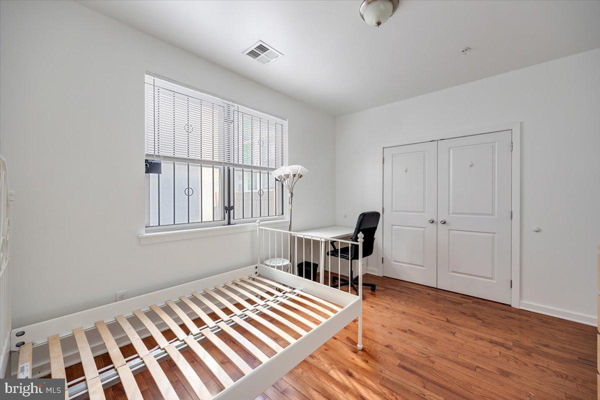 1322 North 15th Street, Unit A Philadelphia, PA 19121 - Photo 10 of 27 a bedroom with furniture and a window